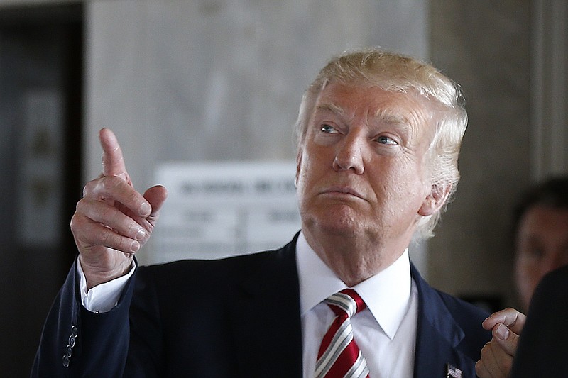 
              FILE – In this Aug. 16, 2016, file photo, Republican presidential candidate Donald Trump gestures during a campaign stop at the Milwaukee County War Memorial Center in Milwaukee, Wis. Countless former Democrats in Ohio's blue-collar Mahoning Valley are transferring their adoration for late U.S. Rep. James A. Traficant Jr., D-Ohio, to Trump, while those who knew Traficant say similarities between him and Trump end at the populist bravado and outsized hair. (AP Photo/Gerald Herbert, File)
            