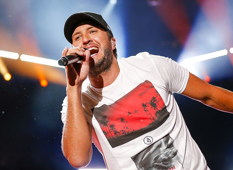 
              FILE - In this June 12, 2016 file photo, Luke Bryan performs at the CMA Music Festival in Nashville, Tenn. The country singer is in currently performing in his Farm Tour, where he brings concerts to working farms in small agriculturally-focused communities and cities throughout the South and Midwest. (Photo by Al Wagner/Invision/AP, File)
            