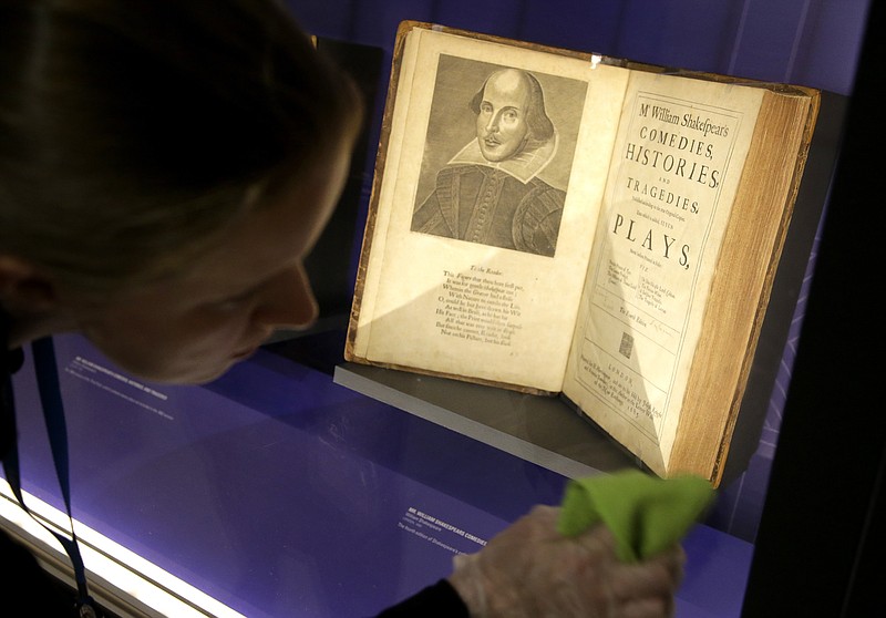 
              In this Tuesday, Oct. 11, 2016 photo book conservator Lauren Schott polishes a case containing 17th century editions of plays attributed to William Shakespeare in an exhibit called "Shakespeare Unauthorized" at the Boston Public Library, in Boston. The public is to get a rare glimpse of first and early editions of some of Shakespeare's most beloved plays, including "A Midsummer Night's Dream," Hamlet" and "The Merchant of Venice" in the exhibit which opens Friday, Oct. 14 and is to run through March 31 at the library. (AP Photo/Steven Senne)
            