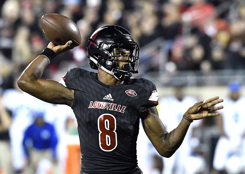 
              Louisville's Lamar Jackson (8) attempts a pass during the first half of an NCAA college football gamen against Duke, Friday, Oct. 14, 2016, in Louisville, Ky. (AP Photo/Timothy D. Easley)
            