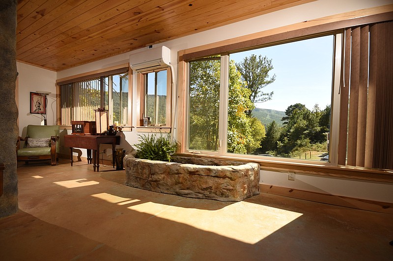 The 500-square-foot Bedrock Cave House features a picture window with a view to the western face of Lookout Mountain.