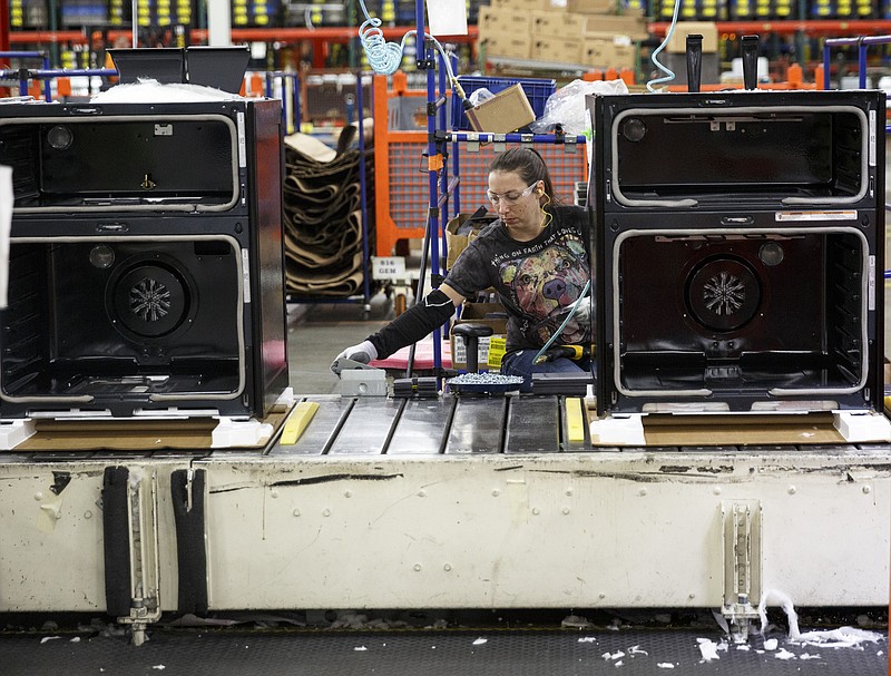 Staff photo by Doug Strickland / A worker assembles an appliance at the Whirlpool manufacturing plant in Cleveland, Tenn.