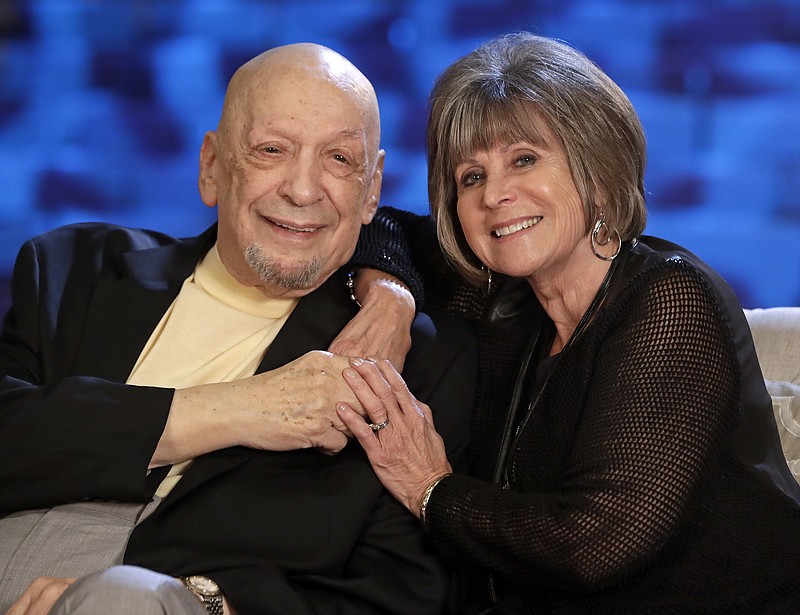 
              In this Sept. 22, 2016 photo, songwriter Fred Foster poses with Barbara “Bobbie" Eden, right, at the Country Music Hall of Fame and Museum in Nashville, Tenn. Eden's last name was McKee when she worked as a secretary in the same office building with Foster when he and Kris Kristofferson wrote “Me and Bobby McGee.” Her name was the inspiration for the song. (AP Photo/Mark Humphrey)
            