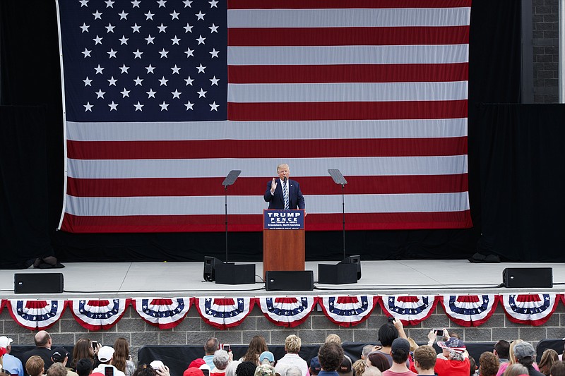 
              Republican presidential candidate Donald Trump speaks during a campaign rally, Friday, Oct. 14, 2016, in Greensboro, N.C. (AP Photo/ Evan Vucci)
            