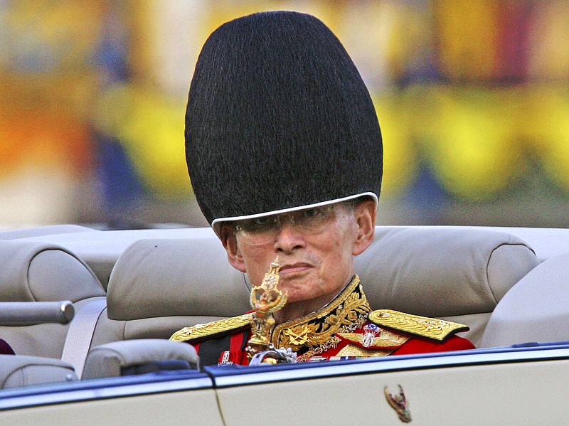 
              FILE - In this Saturday, Dec. 2, 2006, file photo, Thailand's King Bhumibol Adulyadej reviews the honor guard during celebrations of his 79th birthday in Bangkok. Thailand's Royal Palace said on Thursday, Oct. 13, 2016, that King Bhumibol, the world's longest-reigning monarch, has died at age 88. (AP Photo/Sakchai Lalit, File)
            