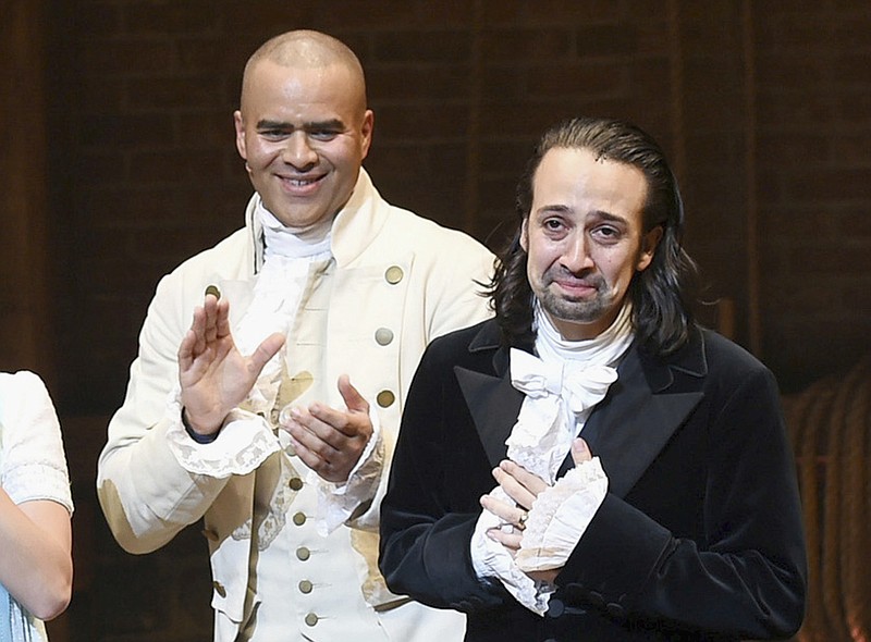 
              FILE - In this July 9, 2016 file photo, actor and "Hamilton" creator Lin-Manuel Miranda, right, takes his final performance curtain call with cast member Christopher Jackson at the Richard Rogers Theatre in New York. Jackson, who earned a Tony nomination for originating the role of George Washington in “Hamilton,” is leaving the Broadway show on Nov. 13. (Photo by Evan Agostini/Invision/AP, File)
            