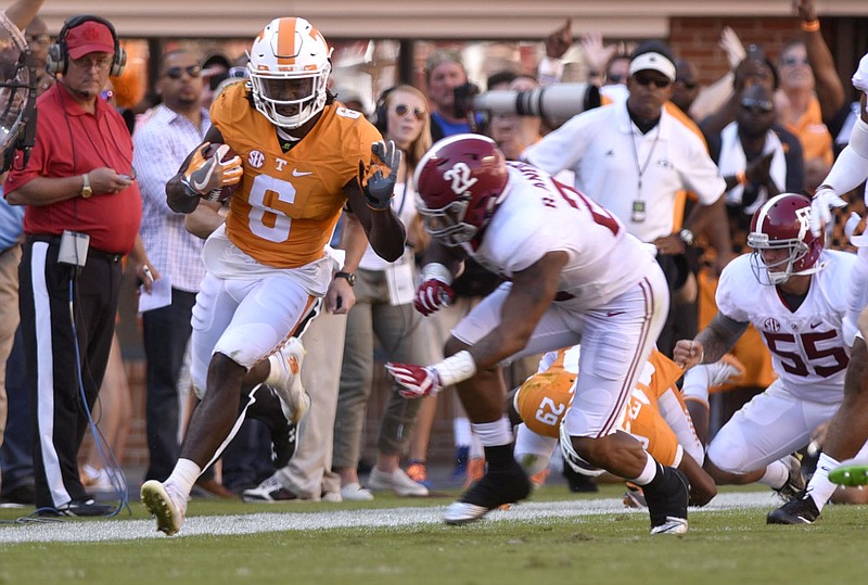Tennessee's Alvin Kamara gets a big Tennessee gain before being knocked out-of-bounds by Alabama's Ryan Anderson (22).  The top-ranked University of Alabama Crimson Tide visited the University of Tennessee Volunteers in SEC football action on October 15, 2016
