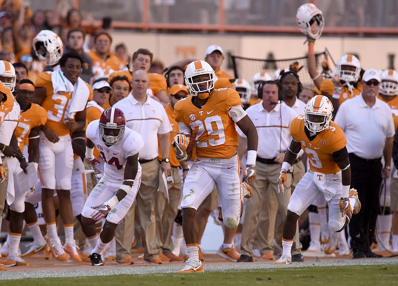 The Tennessee bench erupts as Evan Berry (29) runs during a long kickoff return.  The top-ranked University of Alabama Crimson Tide visited the University of Tennessee Volunteers in SEC football action on October 15, 2016
