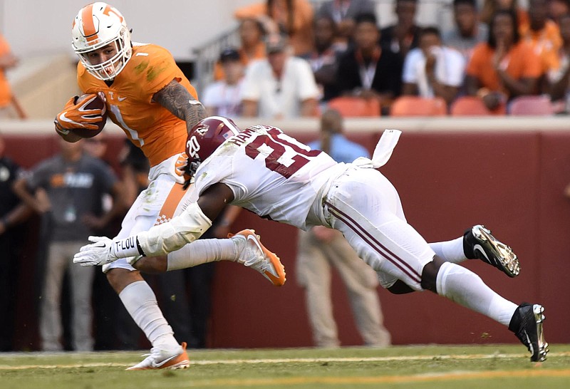 Tennessee's Jalen Hurd (1) is tackled by Shan Dion Hamilton (20).  The top-ranked University of Alabama Crimson Tide visited the University of Tennessee Volunteers in SEC football action on October 15, 2016