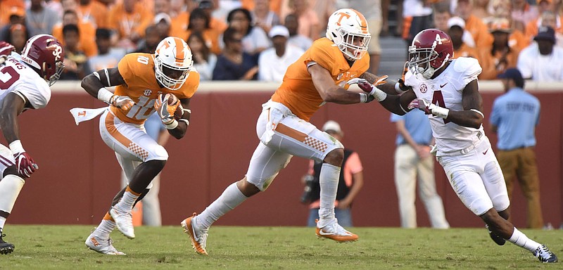 Tennessee's Tyler Byrd (10) runs behind the block of Jalen Hurd (1).  The top-ranked University of Alabama Crimson Tide visited the University of Tennessee Volunteers in SEC football action on October 15, 2016