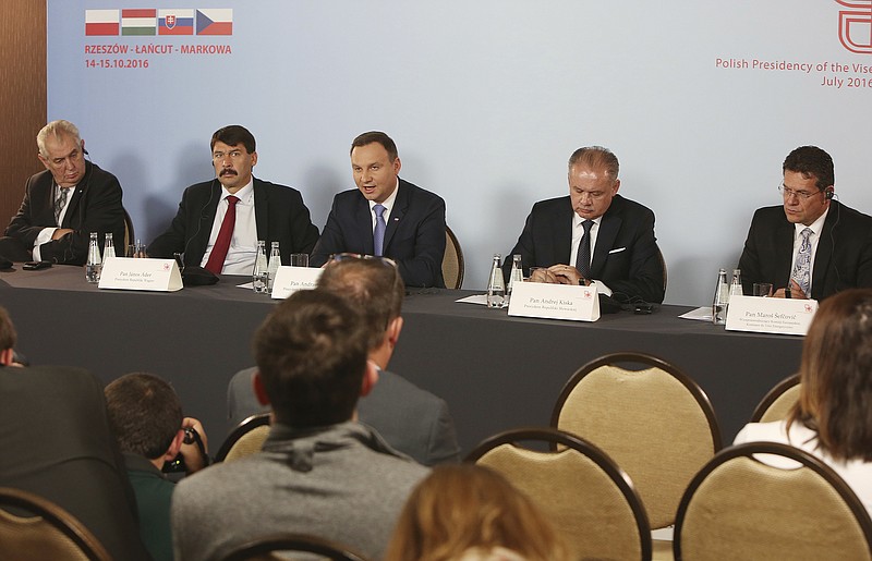 
              Deputy head of European Commision in charge of energy, Maros Sefcovic, right, and the presidents of Central European Visegrad Group: Poland's Andrzej Duda, center, Slovakia's Andrej Kiska, second right, the Czech Republic's Milos Zeman,left, and Hungary's Janos Ader,second left, address a news conference following a meeting on Europe's energy security that closed their two-day summit, in Rzeszow, Poland, Saturday, Oct. 15, 2016.  (AP Photo/Czarek Sokolowski)
            