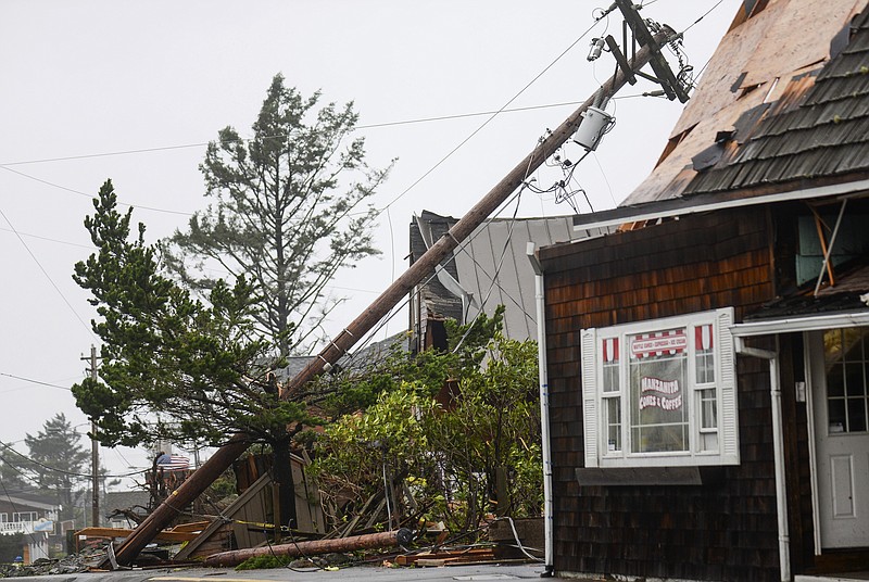 
              Storm debris lays along Laneda Ave, on Friday, Oct. 14, 2016, in Manzanita, Ore. A tornado struck the Oregon beach town as strong winds and heavy rain walloped the Pacific Northwest, leaving thousands without power as utility crews prepare for what's expected to be an even rougher storm on Saturday. (Danny Miller/Daily Astorian via AP)
            