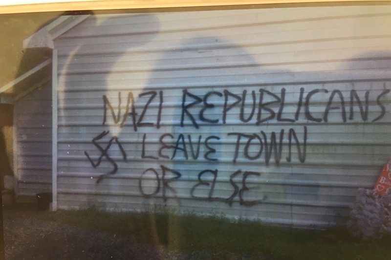 Vandals in North Carolina spray pained this message to area republicans and firebombed the county's GOP headquarters. 