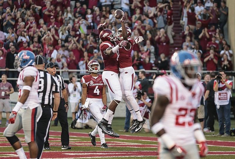 Arkansas' wide receiver Dominique Reed (3) celebrates a touchdown with Arkansas' running back Rawleigh Williams III (22) during the first quarter of an NCAA football game against Mississippi Rebels Saturday, Oct. 15, 2016, in Fayetteville, Ark. (AP Photo/Chris Brashers)


