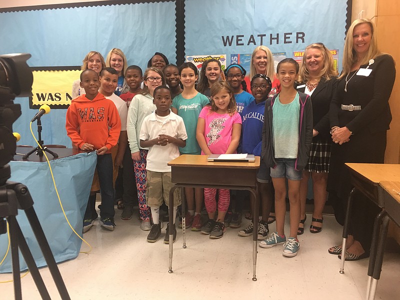 D9 sponsors from Tandem Financial and Tennova Healthcare pose with D9 officials and Wallace A. Smith students after announcing the donation.