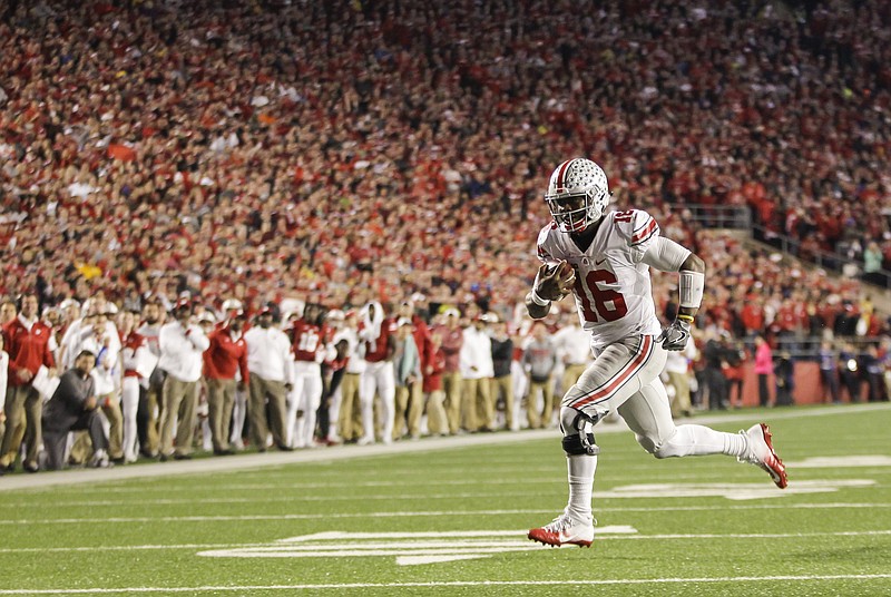 Ohio State quarterback J.T. Barrett against Wisconsin during the second half of an NCAA college football game Saturday, Oct. 15, 2016, in Madison, Wis. Ohio State won 30-23. (AP Photo/Andy Manis)