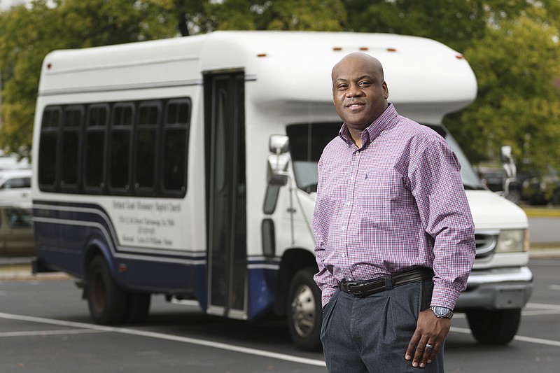 Staff Photo by Dan Henry / The Chattanooga Times Free Press- 10/17/16. Carlos Williams, pastor of Orchard Knob Missionary Baptist Church, speaks about how he plans to use the church busses to shuttle those without transportation to vote once polling opens. 