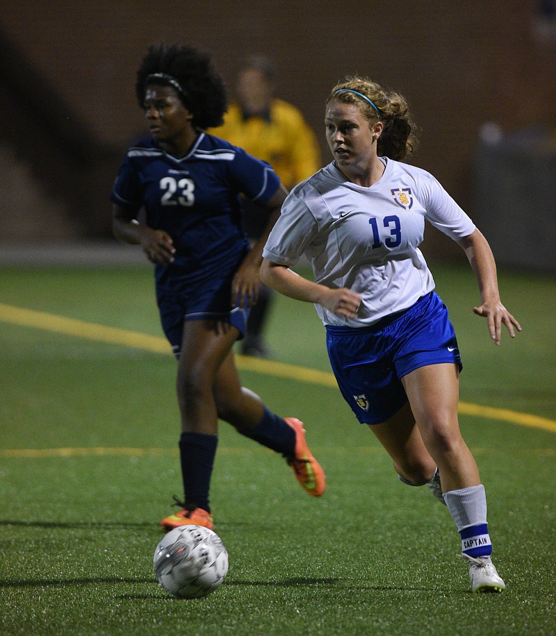 Boyd-Buchanan's Emma Rogers and Arts & Sciences' Lauren Tolbert contend for the ball in the District 5-A/AA final. Both teams are playing in region semifinals tonight.