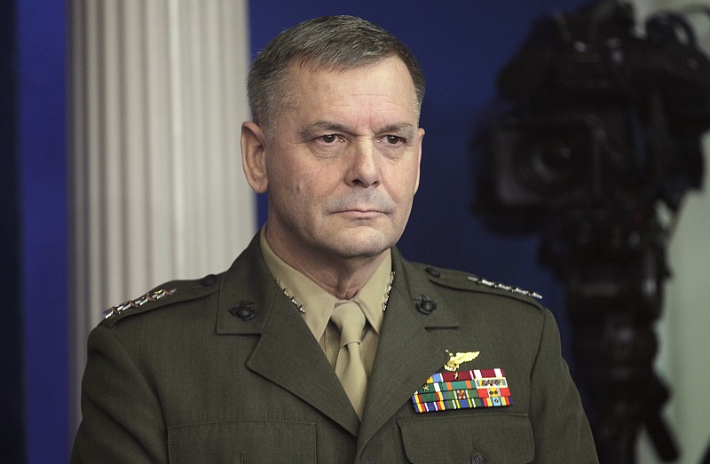 
              FILE - In this Dec. 16, 2010 file photo, then-Joint Chiefs Vice Chairman Gen. James Cartwright listens as President Barack Obama speaks at the White House in Washington. Retired Marine Gen. Cartwright has been charged with making false statements during a federal investigation into a leak of classified information, the Justice Department announced Monday, Oct. 17, 2016.  (AP Photo/Charles Dharapak, File)
            