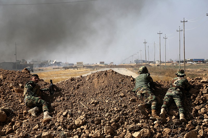 
              Kurdish security forces take up a position as they fight overlooking the Islamic State-controlled in villages surrounding Mosul, in Khazer, about 30 kilometers (19 miles) east of Mosul, Iraq, Monday, Oct. 17, 2016. Iraqi government and Kurdish forces, backed by U.S.-led coalition air and ground support, launched coordinated military operations early on Monday as the long-awaited fight to wrest the northern city of Mosul from Islamic State fighters got underway.(AP Photo)
            