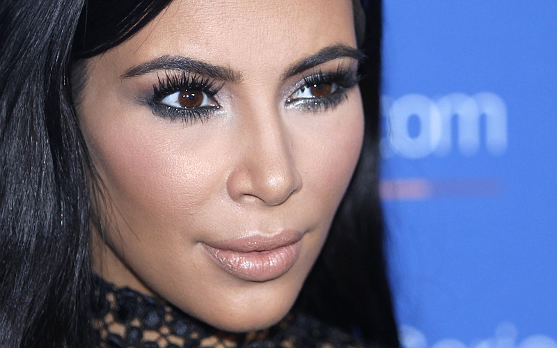 
              FILE - In this June 24, 2015, file photo, Kim Kardashian West poses during a photo call at the Cannes Lions 2015 in Cannes, France. Kardashian is taking some time off from sharing content on her for-pay phone app more than two weeks after she was held up at gunpoint in Paris, according to a handwritten noted posted there Monday by an assistant. (AP Photo/Lionel Cironneau, File)
            