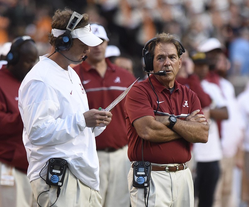 Alabama head coach Nick Saban, right, confers with offensive coordinator Lane Kiffin. The top-ranked University of Alabama Crimson Tide visited the University of Tennessee Volunteers in SEC football action on Oct. 15, 2016.