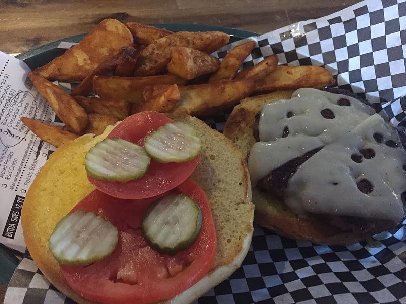 Burgers at the 3rd Deck Burger Bar start with a half-pound of Black Angus beef, prepared medium-well. You can decide what goes on top of it, such as pickles, tomatoes and Swiss cheese, by filling out a menu checklist when you order. Potato wedges are a side option.