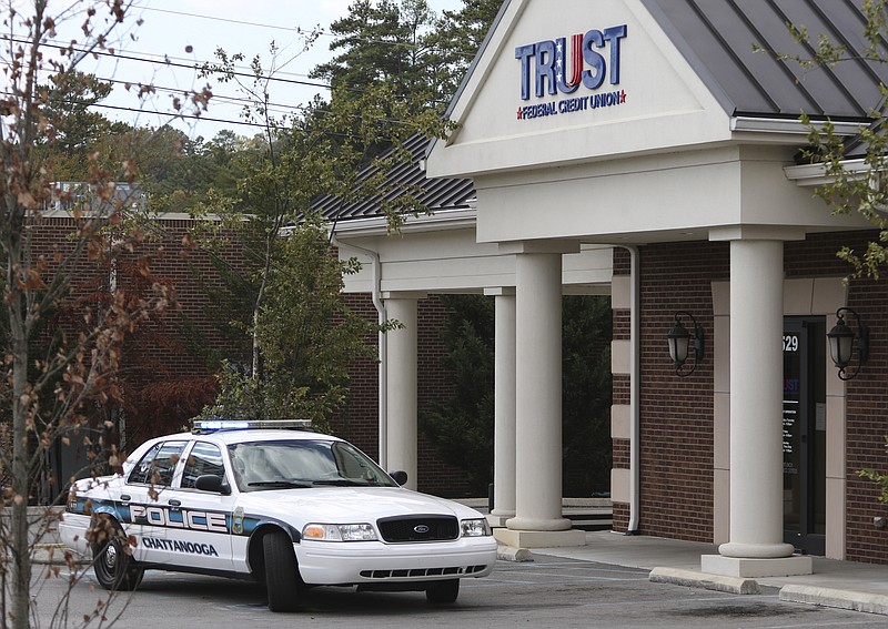 Staff Photo by Dan Henry / The Chattanooga Times Free Press- 10/18/16. Chattanooga police respond to an armed robbery at the Trust Federal Credit Union at 1529 Gunbarrel Road on Tuesday, October 18, 2016. Suspects fled the scene before crashing their get-away vehicle near Skyline Drive.