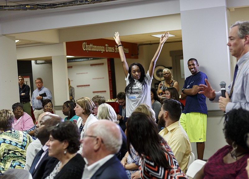 Howard student Akia Lewis raises her hands to ask a question of a panel during a forum hosted by the Times Free Press titled "Study Hall" held at the newspaper's offices to discuss education in Hamilton County on Tuesday, Oct. 18, 2016, in Chattanooga, Tenn. A panel of educators and education administrators answered questions about teacher quality, preparation, and solutions to education issues facing the district.