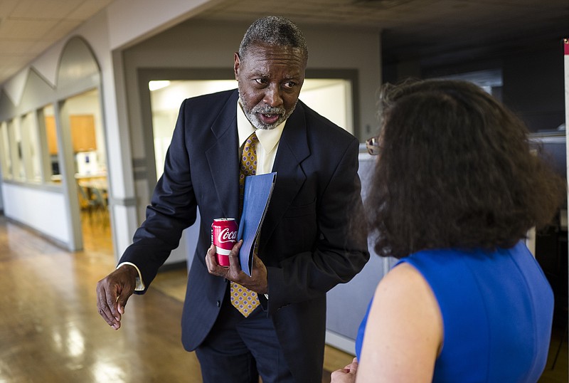 Interim Hamilton County Schools superintendent Kirk Kelly speaks with Bea Lurie before a forum hosted by the Times Free Press titled "Study Hall" held at the newspaper's offices to discuss education in Hamilton County on Tuesday, Oct. 18, 2016, in Chattanooga, Tenn. A panel of educators and education administrators answered questions about teacher quality, preparation, and solutions to education issues facing the district.