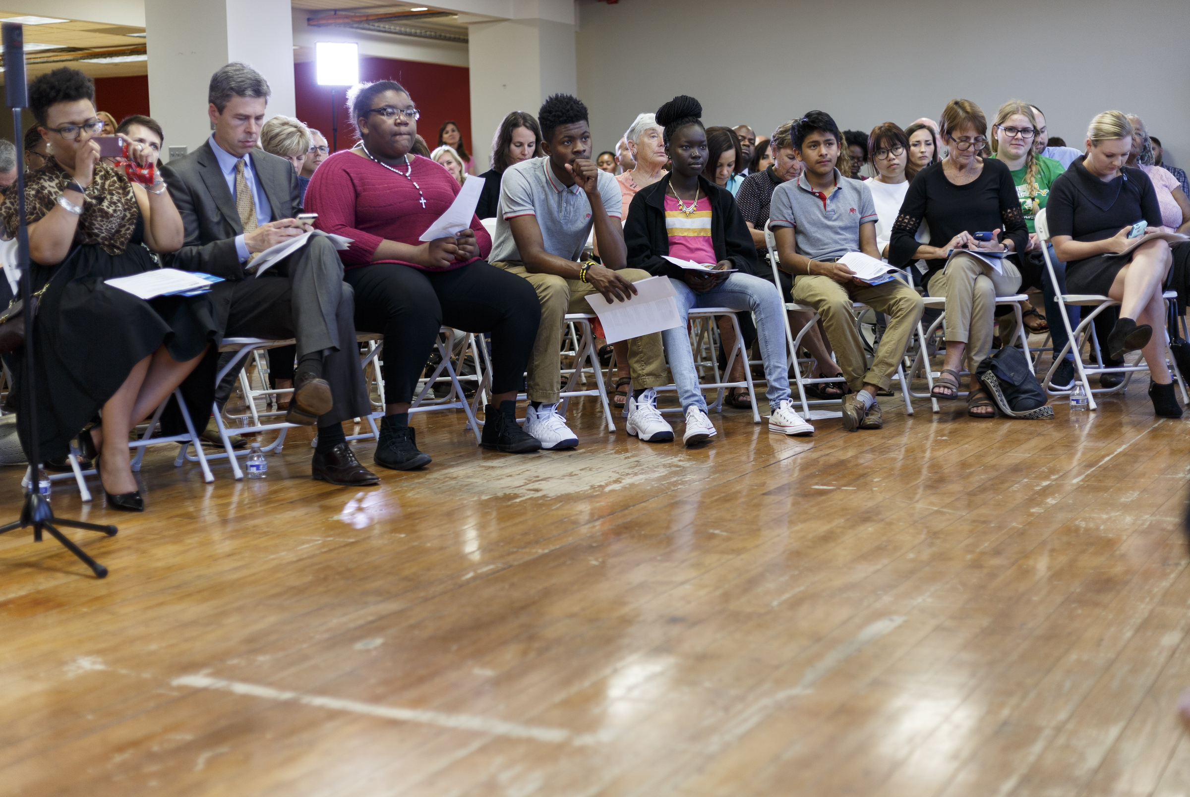 People listen to a panel of speakers during a forum hosted by the Times Free Press titled