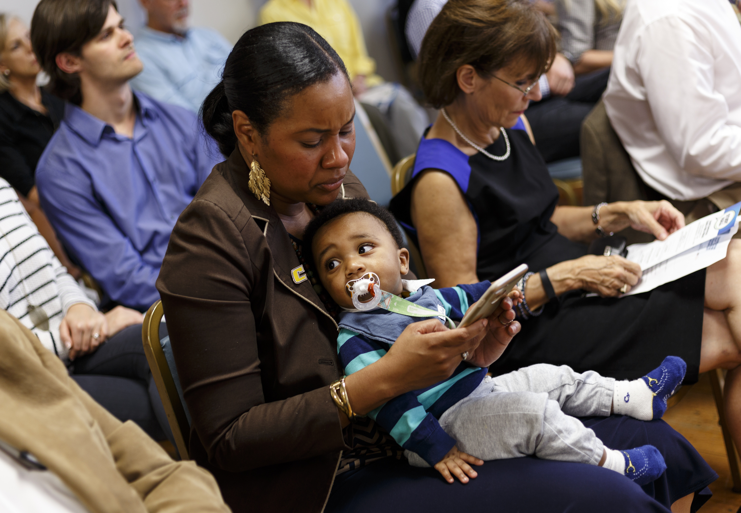 Dr. Jennifer Ellis holds her son Elijah during a forum hosted by the Times Free Press titled