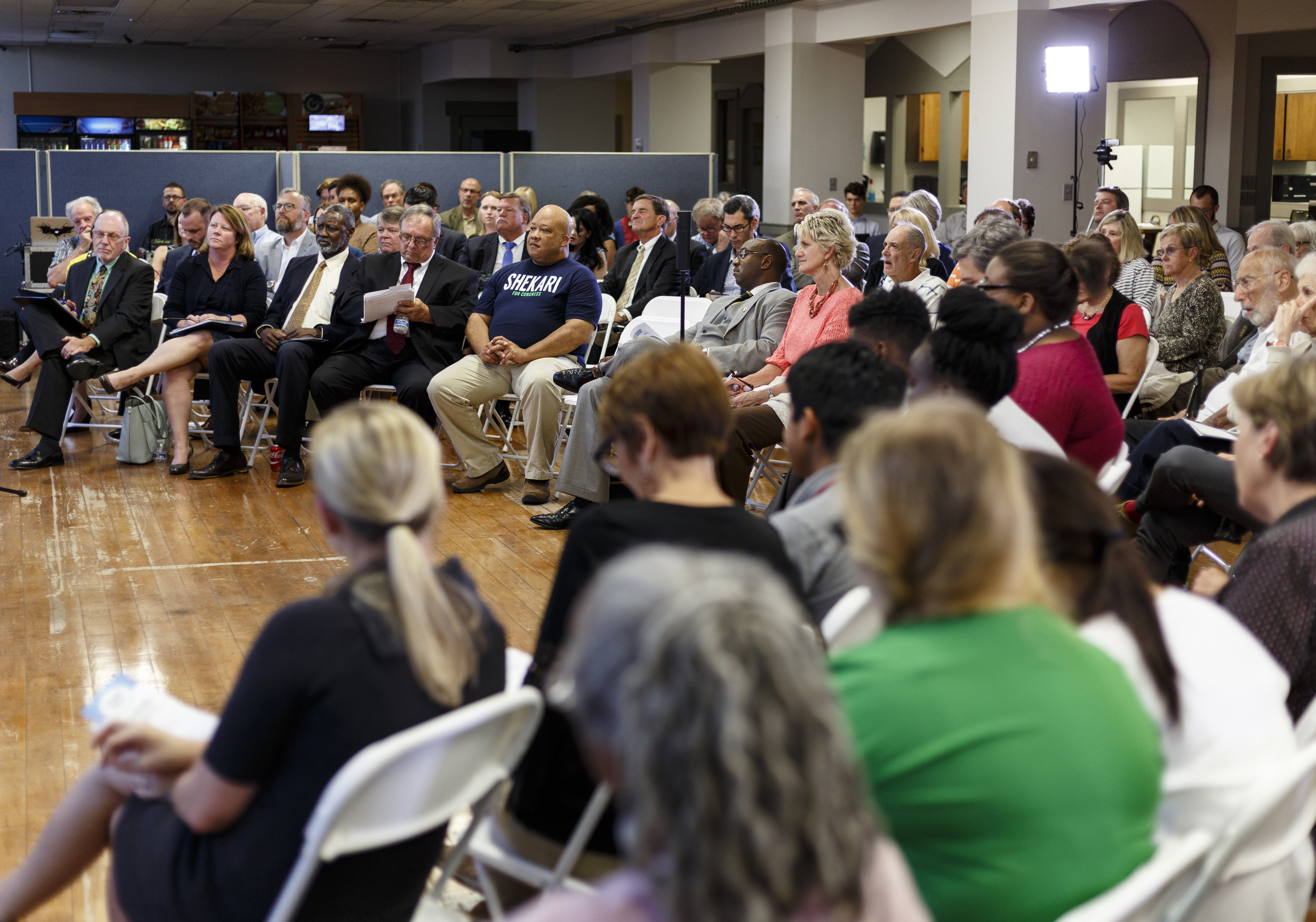 People listen to a panel of speakers during a forum hosted by the Times Free Press titled