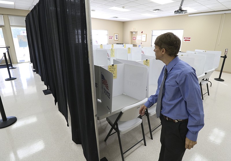 Staff Photo by Dan Henry / The Chattanooga Times Free Press- 10/18/16. Kerry Steelman, Hamilton County Administrator of Elections, speaks about preparations the Election Commission made in preparation for an expected large early voter turnout. Steelman said they doubled the number of voting booths with 47 slots now available, set up two more stations for election personnel to help citizens register, and installed a curtain to give voters privacy from those standing in line. Early voting is available at the Hamilton County Election Commission, the Brainerd Recreation Center, the North River Civic Center near Northgate Mall and Eastwood Baptist Church in Collegedale. 