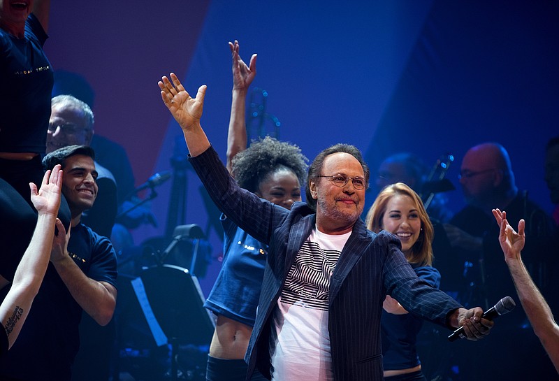 
              Entertainer Billy Crystal performs the opening number during a benefit concert for the Hillary Victory Fund Monday, Oct. 17, 2016, in New York. (AP Photo/Craig Ruttle)
            