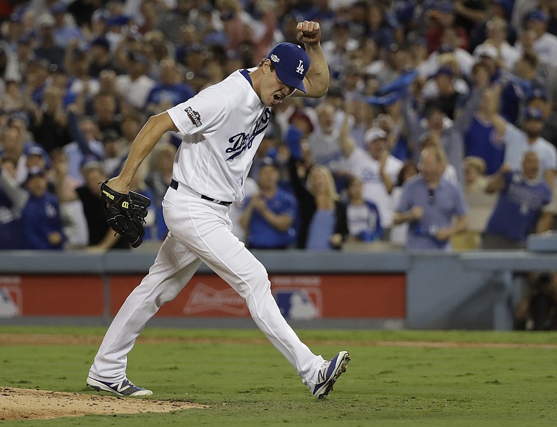 Los Angeles Dodgers starting pitcher Rich Hill reacts after striking out Chicago Cubs' Anthony Rizzo during the sixth inning of Game 3 of the National League baseball championship series Tuesday, Oct. 18, 2016, in Los Angeles.
