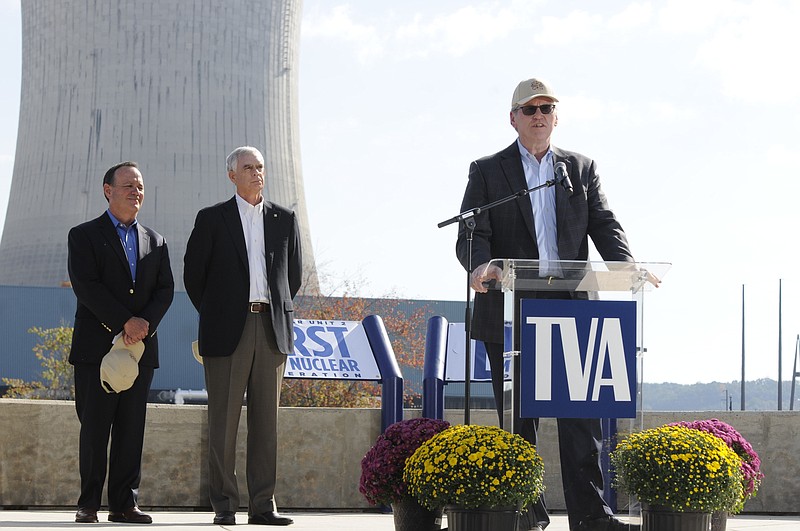 Bill Johnson, right, president and CEO of TVA, talks to the media about Watts Bar Nuclear Plant reaching full power. Mike Skaggs, left, nuclear engineer who headed the start up of Watts Bar, and TVA Executive Vice President Joe Grimes listen Wednesday morning at the announcement.