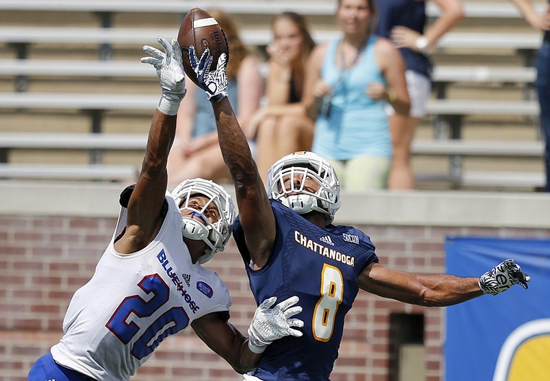 UTC wide receiver C.J. Board, right, competes with Presbyterian defensive back Kenneth Coleman for a pass in the end zone during their game last month at Finley Stadium.