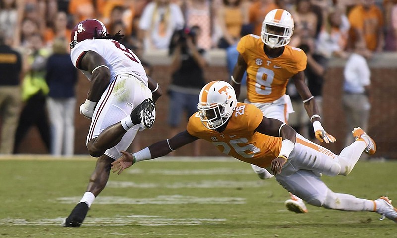 Alabama running back Bo Scarbrough runs past Tennessee's Stephen Griffin during last Saturday's 109-yard performance in the Crimson Tide's 49-10 win in Neyland Stadium.