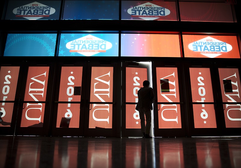 
              A worker leaves the Thomas & Mack Center ahead of the third presidential debate between Democratic presidential nominee Hillary Clinton and Republican presidential nominee Donald Trump at UNLV in Las Vegas, Wednesday, Oct. 19, 2016. (AP Photo/David Goldman)
            