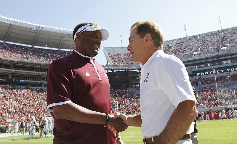 
              FILE - In this Oct, 18, 2014, file photo, Texas A&M head coach Kevin Sumlin, left, and Alabama head coach Nick Saban shake hands before an NCAA college football game in Tuscaloosa, Ala. The SEC West could be all but decided this Saturday. The leader will be determined in Tuscaloosa, Alabama, when the top-ranked Crimson Tide (7-0) faces No. 6 Texas A&M (6-0).  The winner is the only undefeated team left in the Southeastern Conference and loser will need the winner to lose twice to have a chance to win the West. (AP Photo/Butch Dill, File)
            