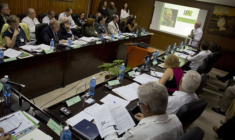 
              U.S. specialists in infections diseases, top left, and Cuban specialists, right, attend a meeting at the Pedro Kouri Tropical Medicine Institute (IPK) in Havana, Cuba, Wednesday, Oct. 19, 2016. The Obama administration sent some of the United States' top infectious disease specialists to Cuba to open a new phase in medical cooperation after more than a half-century of isolation .(AP Photo/Ramon Espinosa)
            