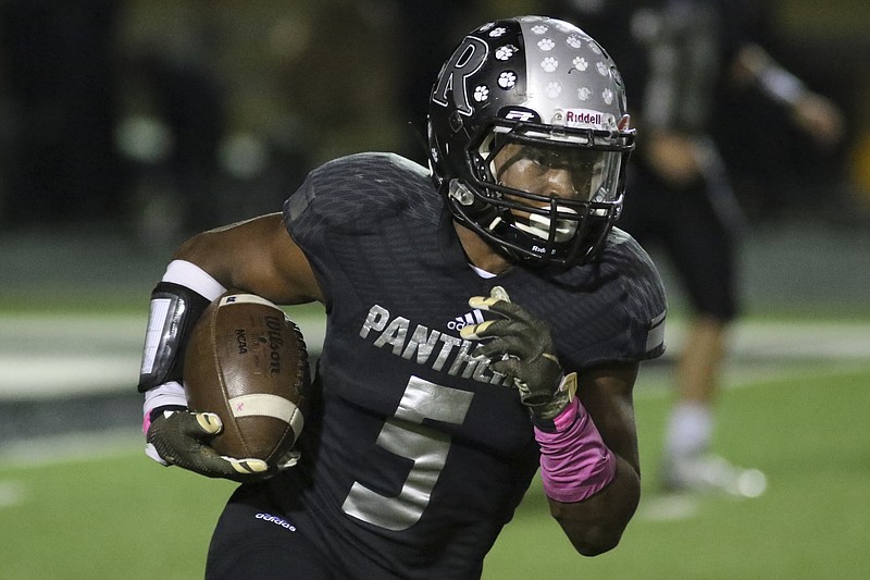 Staff Photo by Dan Henry / The Chattanooga Times Free Press- 10/14/16. Ridgeland High School's Markeith Montgomery (5) gains yardage while playing Heritage High School during the first half of play at the Panthers' home field on Friday, October 14, 2016. 