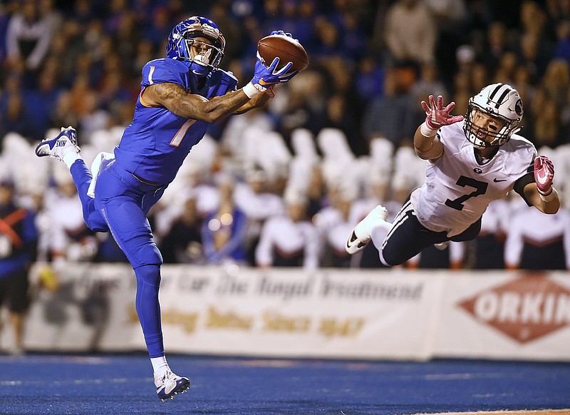 
              Boise State wide receiver Cedrick Wilson (1) catches a deep throw for a touchdown next to BYU defensive back Micah Hannemann (7) during an NCAA college football game Thursday, Oct. 20, 2016, in Boise, Idaho. (Pat Sutphin/The Times-News via AP)
            