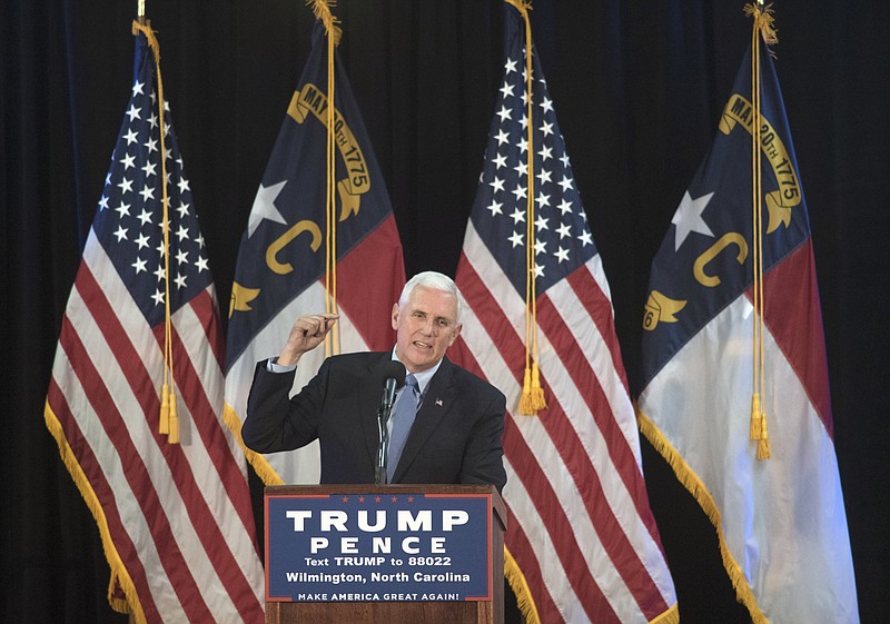 
              FILE - In this Oct. 18, 2016 file photo, Republican vice presidential candidate, Indiana Gov. Mike Pence speaks in Wilmington, N.C. It’s become a familiar routine for Pence. Republican presidential nominee Donald Trump says something headline-grabbing, dubious or outright false, and his mild-mannered running mate sets out to refashion the boss’s argument. It’s happening again this week with the campaign’s most fundamental question: Whether Trump would accept the legitimacy of election results that make Democrat Hillary Clinton president-elect. (AP Photo/Mike Spencer, File)
            