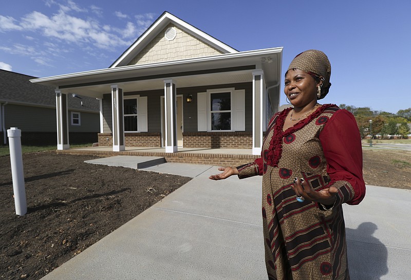 Senga Lucie got to pick out the flooring and paint colors in her new home before it was built and now she's looking forward to hosting guests. "I will cook fufu [a dough-liked dish that is dipped into a beefy broth]. It is eaten with the fingers."