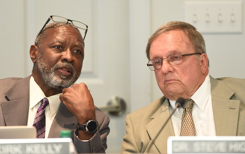 Hamilton County Board of Education Chairman Dr. Steve Highlander, right, confers with Interim Superintendent Dr. Kirk Kelly during a school board meeting.