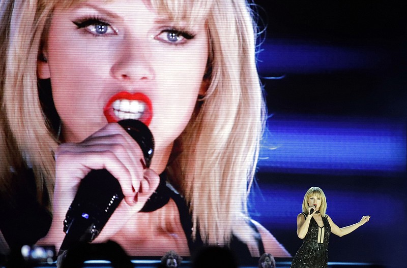 
              Taylor Swift performs on the eve of the Formula One U.S. Grand Prix auto race at Circuit of the Americas, Saturday, Oct. 22, 2016, in Austin, Texas. (AP Photo/Darron Cummings)
            