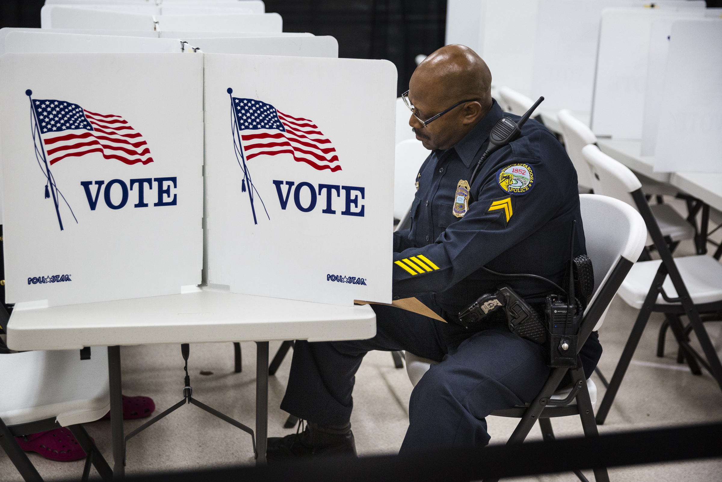 Chattanooga police officer Tetzel Tillery casts his ballot during early voting at the Hamilton County Election Commission on Amnicola Highway on Saturday, Oct. 22, 2016, in Chattanooga, Tenn.