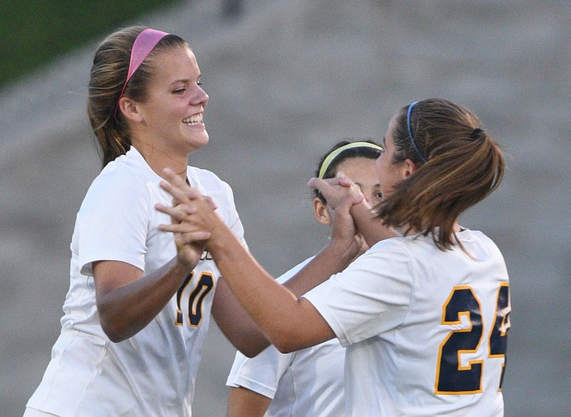 Chattanooga Christian's Jenna Rogers, right, congratulates Addie Henry after she scored the first goal of the game against Notre Dame on Sept. 15. Both teams will be in the Class A/AA state tournament this week in Murfreesboro.